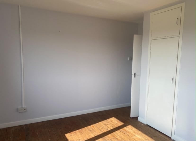 Renovated bedroom with built-in wardrobe