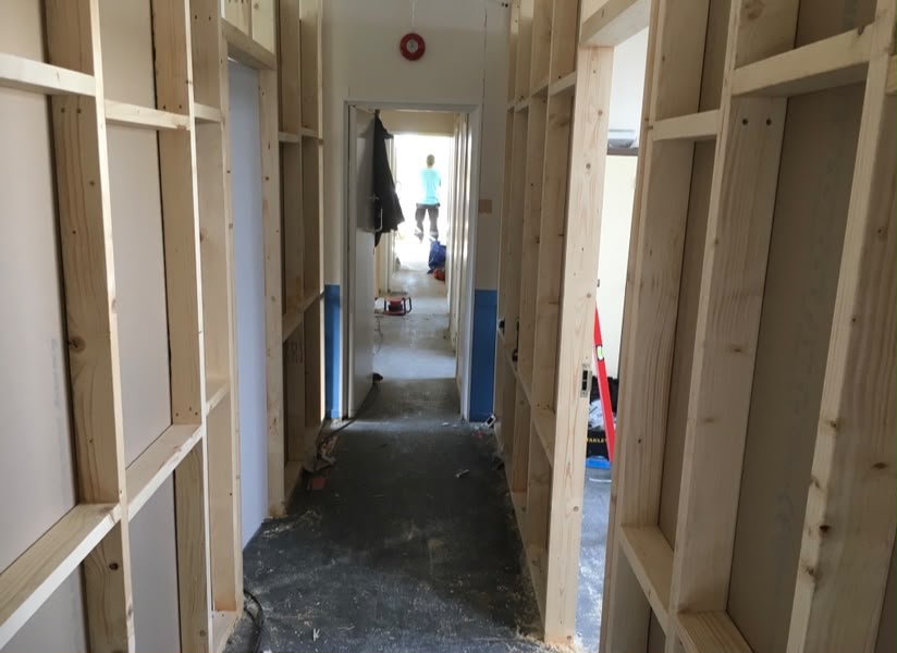 Room with plasterboard walls and door fitted